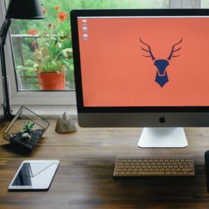 Mac desktop next to iPad